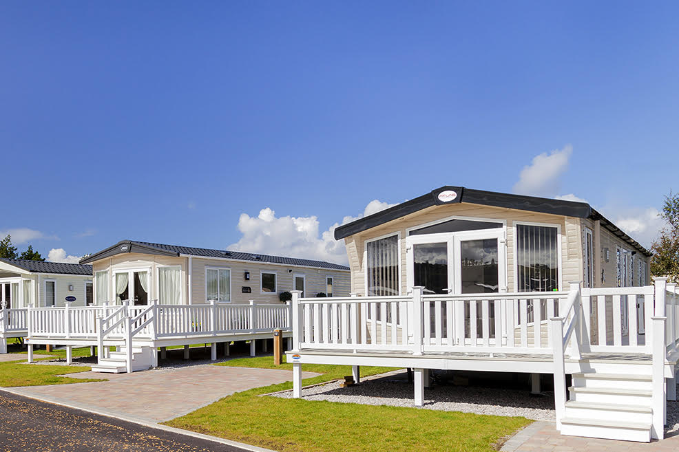 A modern static caravan sited at a scenic UK holiday park