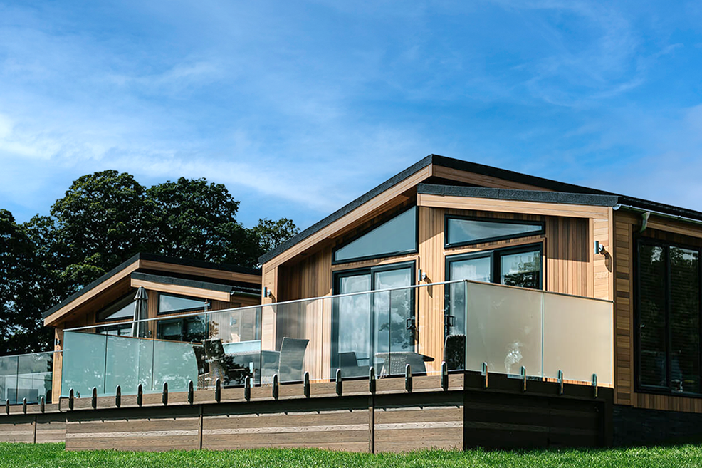 A large luxury double lodge sited at a scenic UK holiday park
